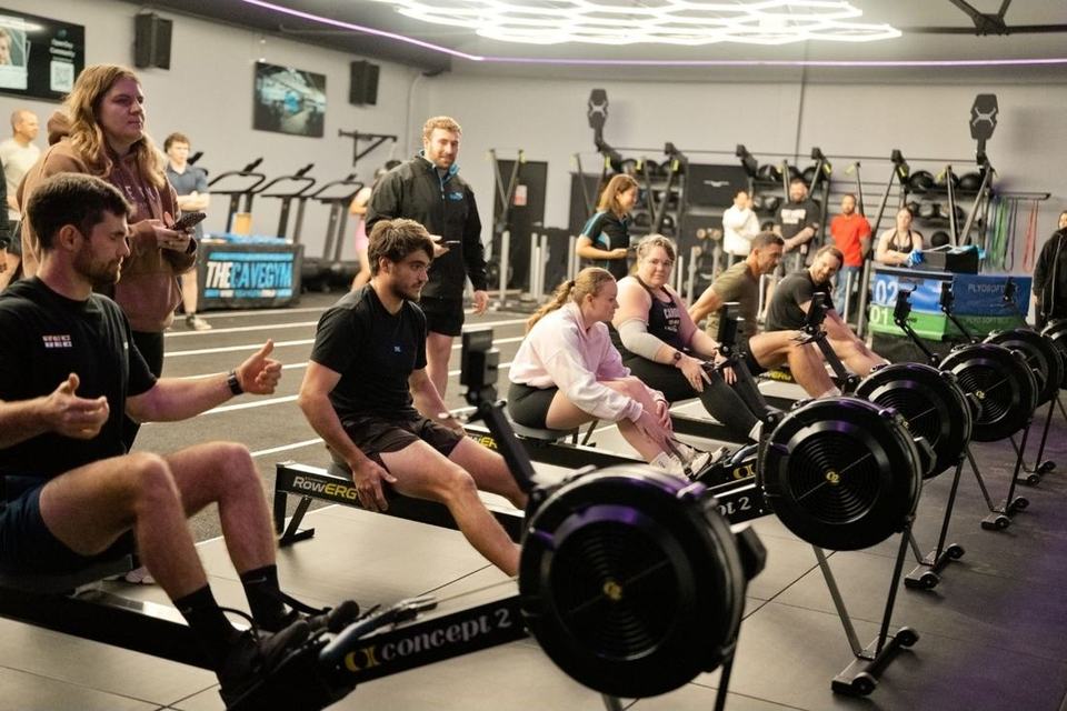 A full line of rowers mid-race